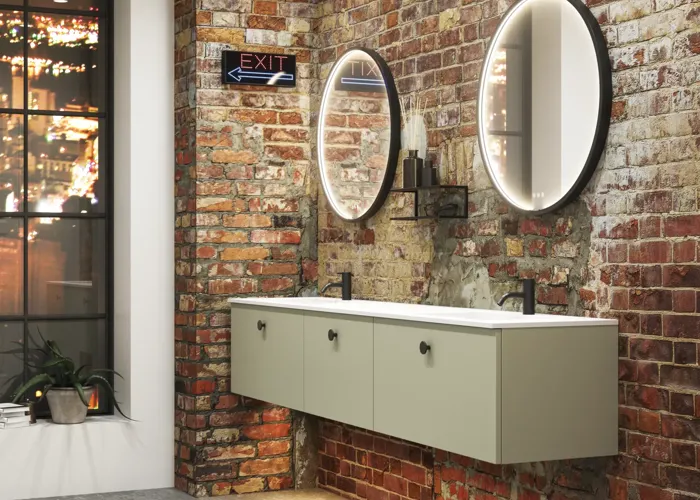 Raw and modern bathroom in an urban style. Beautiful vanity units and black framed round mirrors